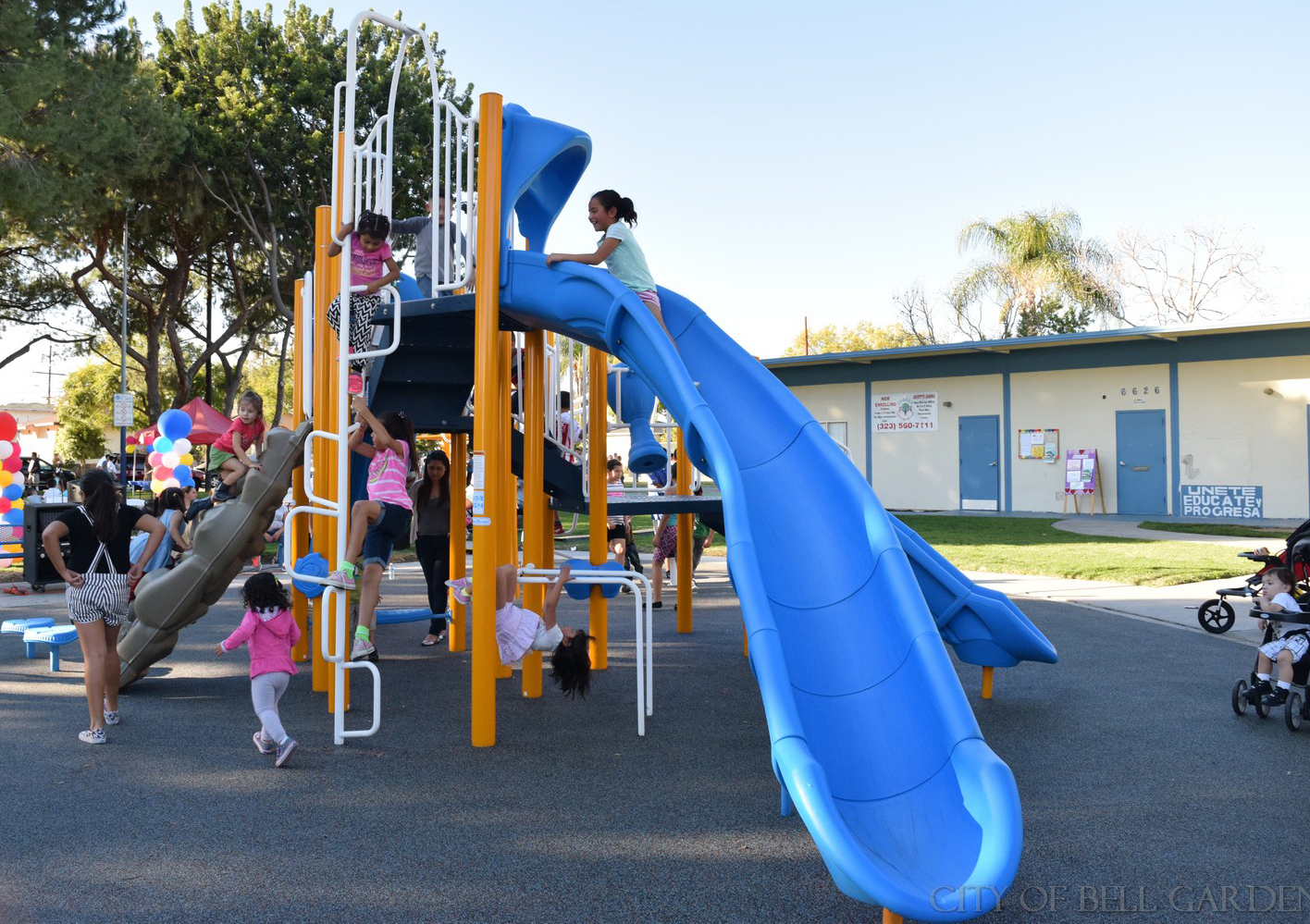 A large plastic slide is one of the best features of Bell Gardens' new playground.